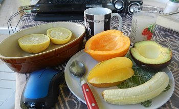 breakfast of fruit, juice and coffee