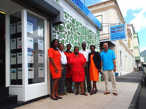 Safehaven team outside their Bayfront outlet, Roseau
